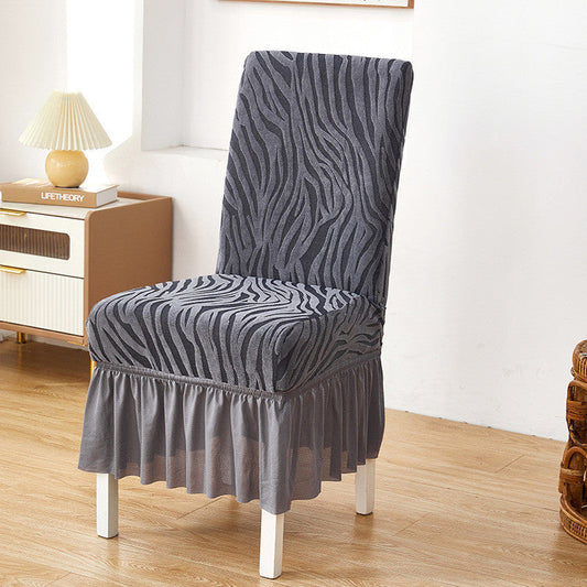 Grey zebra chair cover with textured fabric and stretchable design for a snug fit on standard chairs