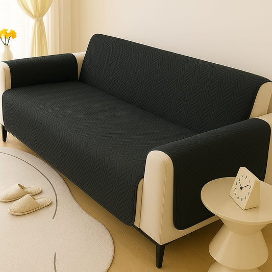 Black zigzag ultrasonic quilted sofa cover on living room sofa