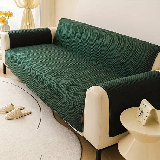 Green zigzag ultrasonic quilted sofa cover on living room sofa