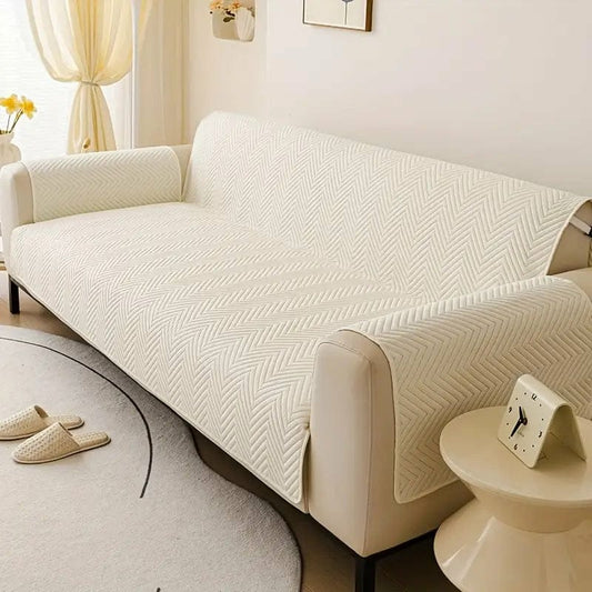 Off white zigzag ultrasonic quilted sofa cover on living room sofa