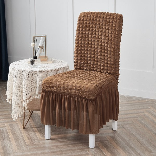 Copper brown bubble chair cover with textured fabric and stretchable design for a snug fit on standard chairs