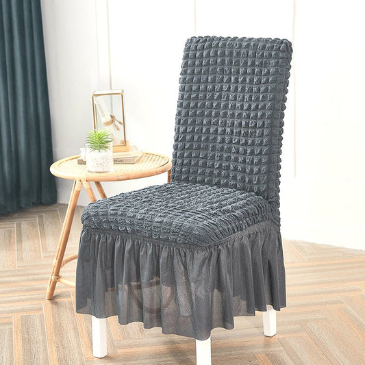 Dark gray bubble chair cover with textured fabric and stretchable design for a snug fit on standard chairs
