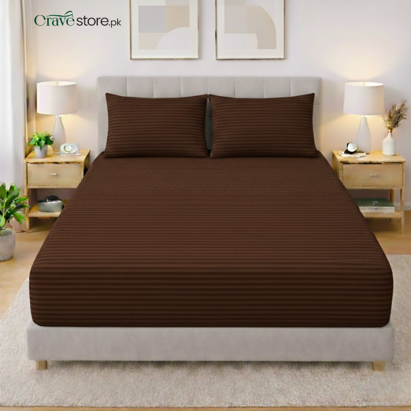 Chocolate brown striped king size flat bedsheet with two matching pillow covers on bed