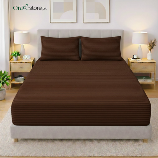 Chocolate brown striped king size flat bedsheet with two matching pillow covers on bed