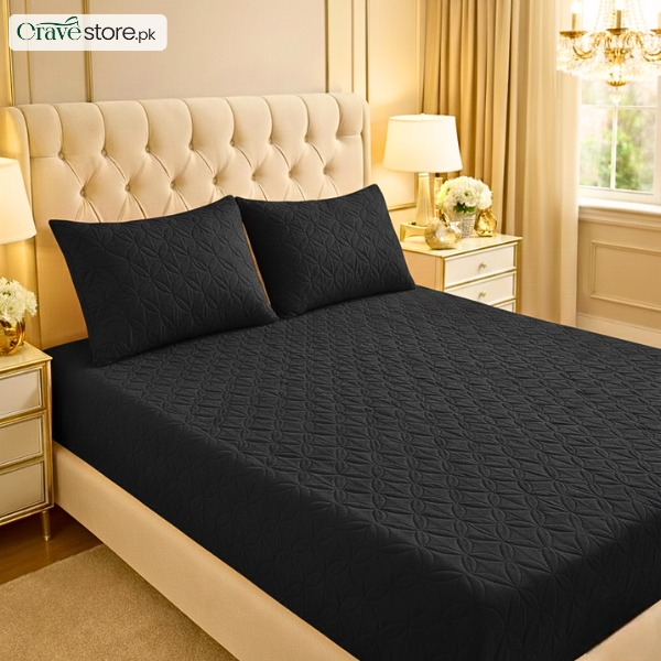 Ultrasonic quilted black fitted bedsheet set on king size bed