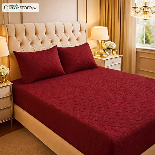 Ultrasonic quilted maroon fitted bedsheet set on king size bed