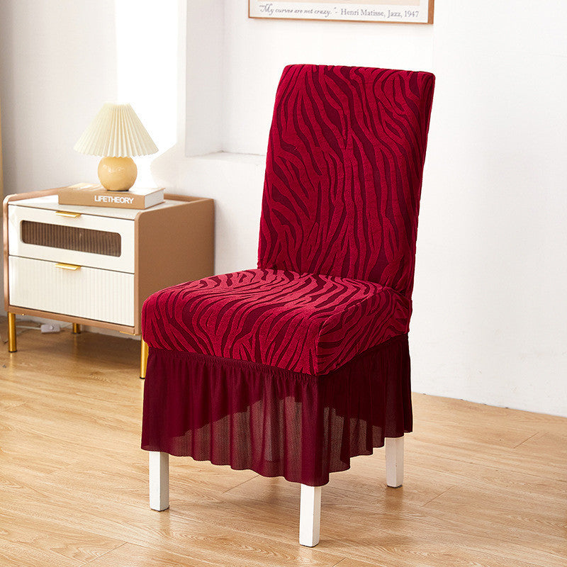 Maroon zebra chair cover with textured fabric and stretchable design for a snug fit on standard chairs
