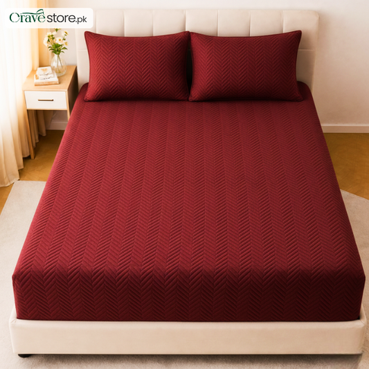Zigzag ultrasonic quilted maroon fitted bedsheet set on king size bed